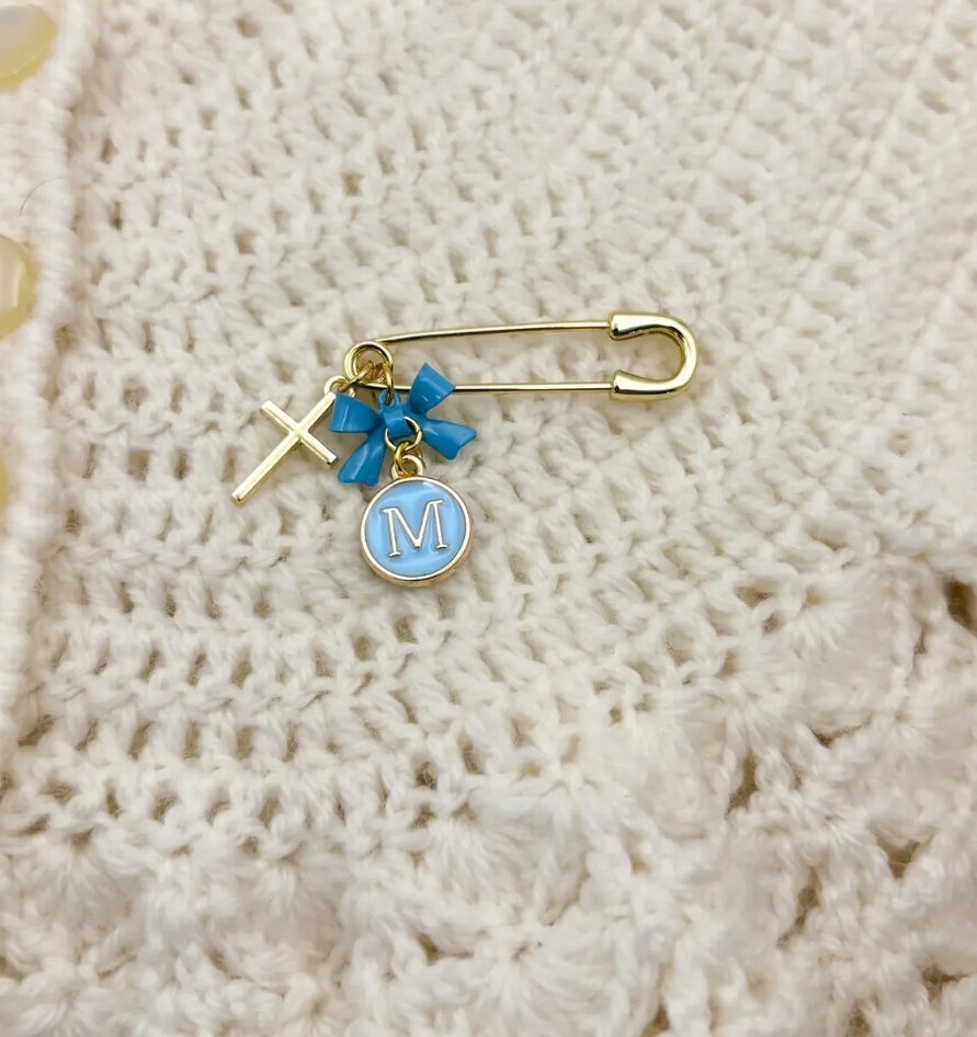 Small gold pin personalised with bow, letter charm and cross