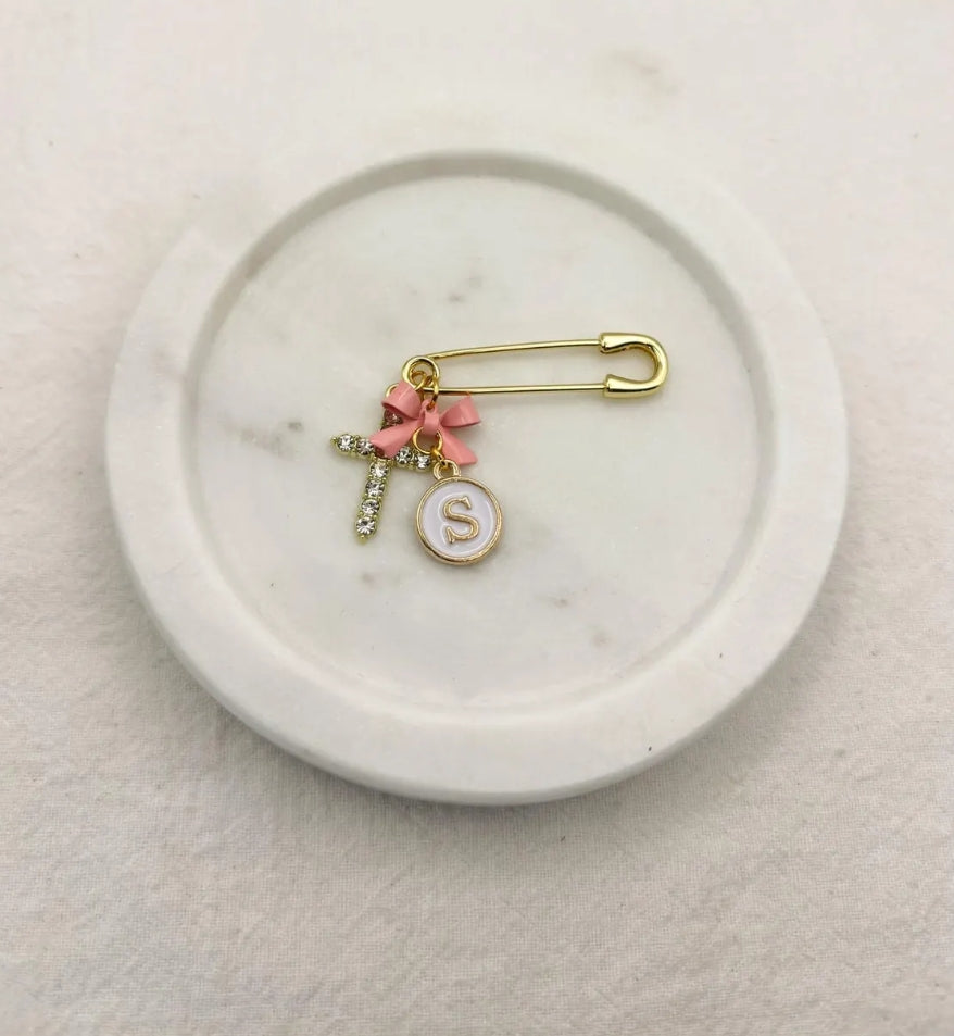 Small gold pin personalised with bow, letter charm and cross